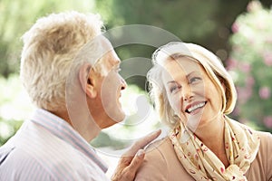 Portrait Of Senior Couple Relaxing On Sofa