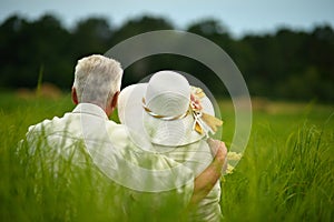 Portrait of senior couple resting in park