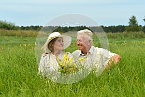 Portrait of senior couple resting in park