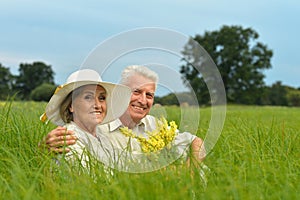 Portrait of senior couple resting in park