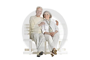 Portrait of senior couple sitting on bench