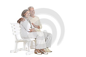 Portrait of senior couple sitting on bench