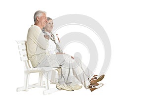 Portrait of senior couple sitting on bench