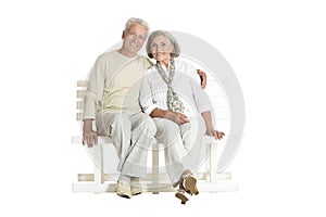 Portrait of senior couple sitting on bench