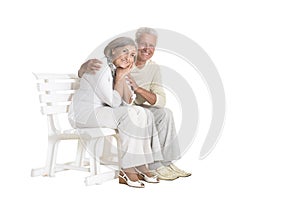 Portrait of  senior couple sitting on bench