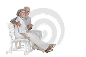 Portrait of senior couple sitting on bench
