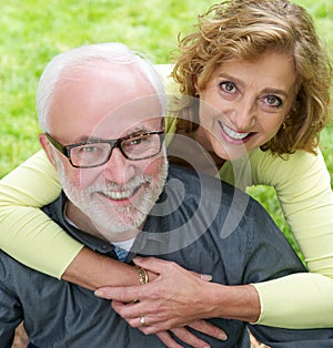 Portrait of a senior couple smiling together outdoors