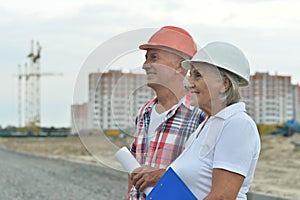 Portrait of senior couple in under construction