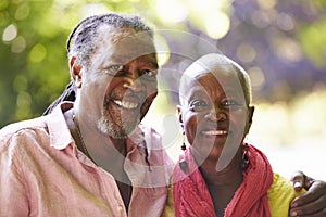 Portrait Of Senior Couple On Walk In Countryside Together