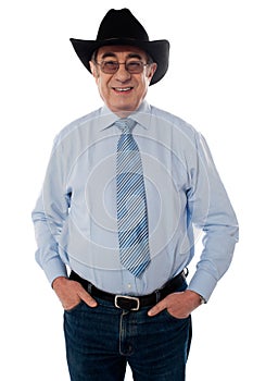 Portrait of a senior cowboy wearing hat