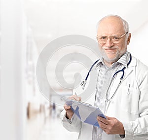 Portrait of senior doctor on hospital corridor