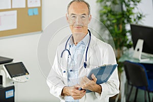 Portrait senior doctor in medical office