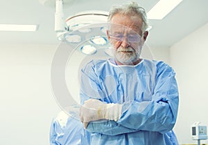 Portrait of senior doctor in operating room
