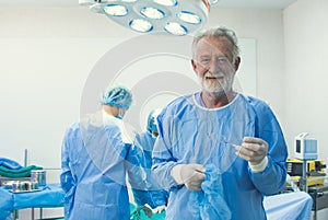 Portrait of senior doctor in operating room