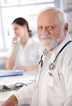 Portrait of senior doctor smiling