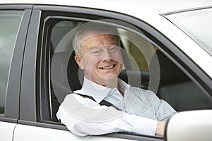 Portrait Of Senior Driver In Car