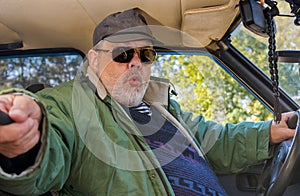 Portrait of senior driver making popular selfie