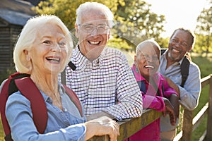 Portrait Of Senior Friends Hiking In Countryside