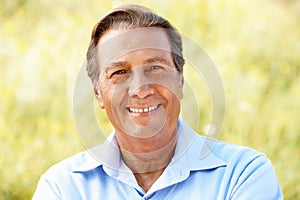 Portrait senior Hispanic man outdoors