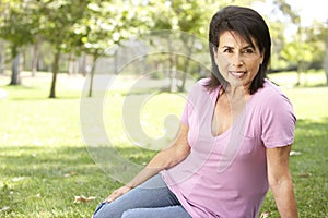 Portrait Of Senior Hispanic Woman In Park