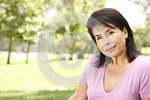 Portrait Of Senior Hispanic Woman In Park