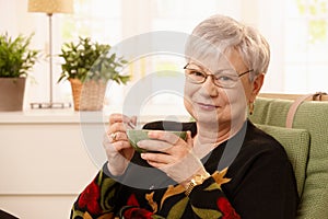 Portrait of senior lady drinking tea