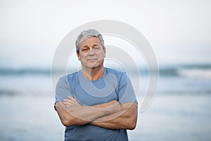 Portrait of a senior man on blurry sea background
