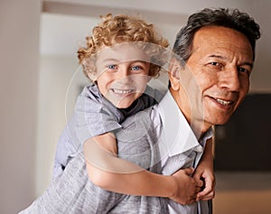 Portrait, senior man and boy with smile for multiracial family, bonding and together at home. Happy, grandfather and