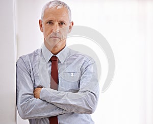 Portrait, senior man and business with arms crossed, mockup space or employee in workplace. Face, mature person or