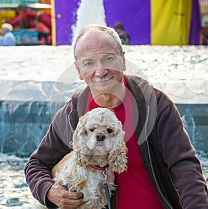 Portrait of senior man with a dog