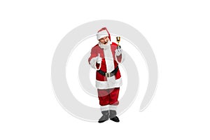 Portrait of senior man in image of Santa Claus standing with winning trophy isolated over white background