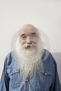 Portrait of senior man over gray background