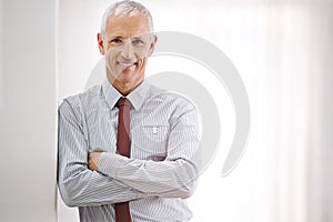 Portrait, senior man and professional with arms crossed, mockup space or agent in workplace. Face, mature person or