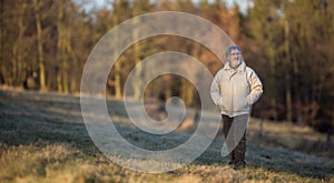 Portrait of a senior man relaxing during a walk outdoors