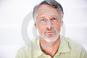 Portrait, senior man and serious in mockup with employee, career pride and positive in studio. Mature person, face and