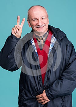 Portrait of a senior man showing ok sign