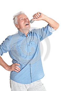 Portrait of senior man in singing with microphone