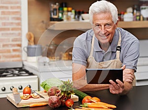 Portrait, senior man and tablet in kitchen with vegetables for cooking video, knife and health. Tech, food and face of