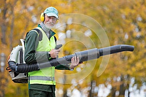 Portrait Senior Man Worker with Leaf Blower