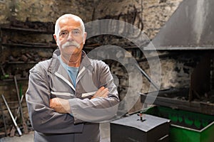 Portrait of senior metalworker photo