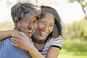 Portrait Of Senior Mother With Adult Daughter In Park photo