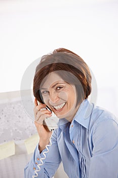 Portrait of senior office worker on phone