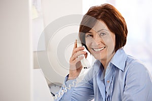 Portrait of senior office worker smiling