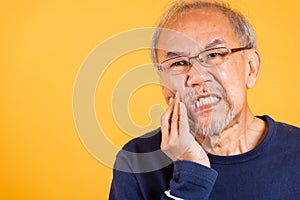 Portrait senior old man sad hand touching cheek suffering from toothache