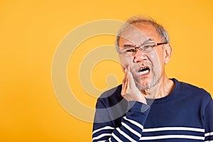 Portrait senior old man sad hand touching cheek suffering from toothache