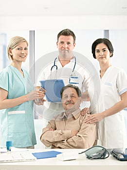 Portrait of senior patient and medical crew