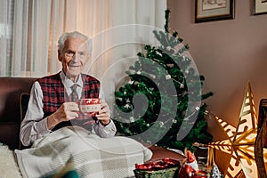 Portrait of Senior Retired Man Sitting at Home