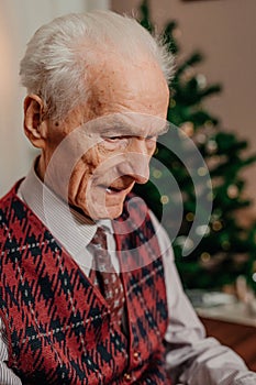 Portrait of Senior Retired Man Sitting at Home