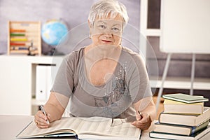 Portrait of senior teacher working