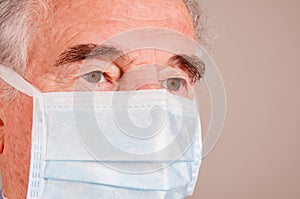 Portrait Of Senior Wearing Surgical Mask 